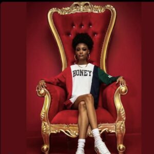 Young black girl in red throne chair